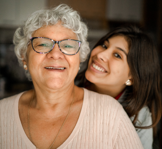 older woman and young woman smiling